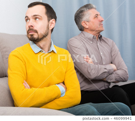 Adult father and son solve problems Adult father and son solve problems 46099941