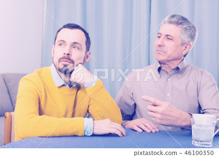 Mature father and son serious talk Mature father and son serious talk 46100350