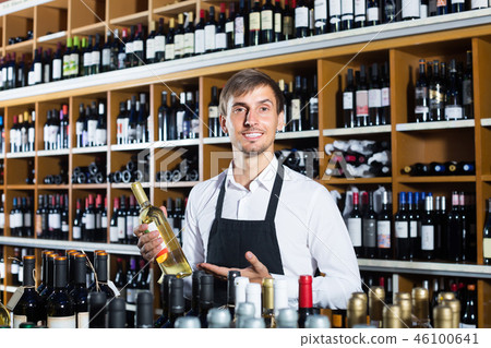 male seller in wine store. 46100641