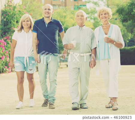 positive elderly friends walking outdoor positive elderly friends walking outdoor 46100923