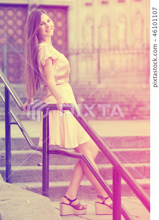 young woman walking in historic city center young woman walking in historic city center 46101107