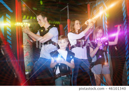 Kids and adults in beams on lasertag arena 46101340