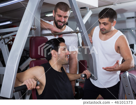 Three male friends in gym Three male friends in gym 46101373