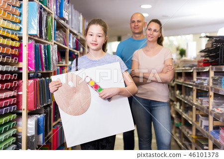 girl with stationery during family shopping girl with stationery during family shopping 46101378