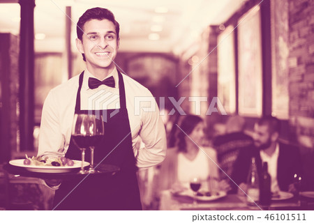 Waiter posing in restaurant 46101511