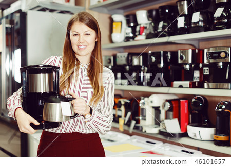 woman demonstrating coffee machine 46101657