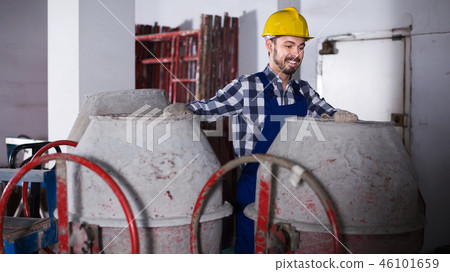 Worker work with cement mixer Worker work with cement mixer 46101659