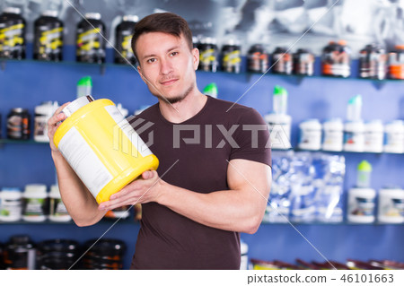 Portrait of active guy with sport nutrition Portrait of active guy with sport nutrition 46101663