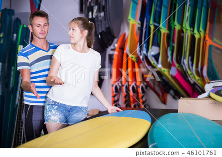 Joyful couple is choosing colorful boards 46101761