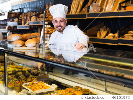 Young male seller is demonstrating assortment Young male seller is demonstrating assortment 46101973