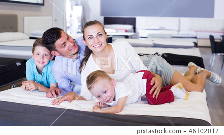 Family choosing mattress in store Family choosing mattress in store 46102012