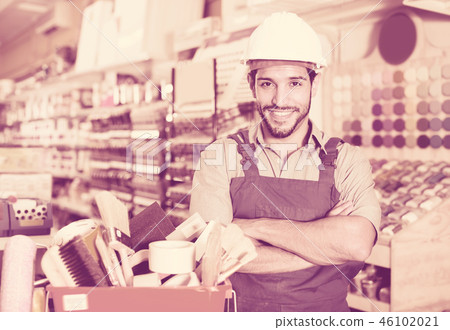 Happy master standing near basket with tools Happy master standing near basket with tools 46102021