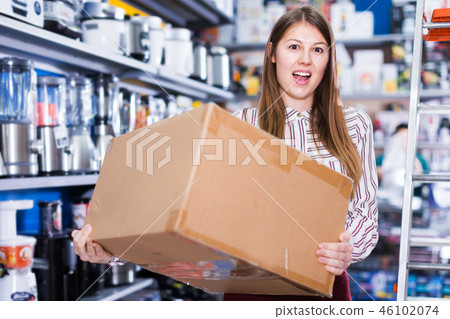 Girl holding box with purchase 46102074