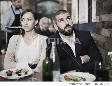 Portrait of upset man and woman in the restaurant on meeting 46102255