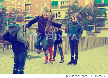 children playing rubber band 46102537