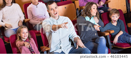 Number of people enjoying exciting film 46103445