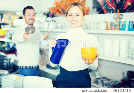 Couple selecting crockery in store Couple selecting crockery in store 46103710
