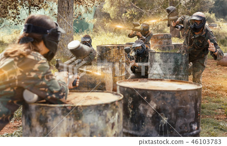 gambling teams facing on battlefield in outdoor paintball arena gambling teams facing on battlefield in outdoor paintball arena 46103783