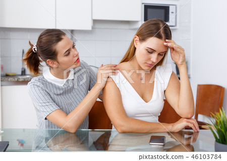 Girl embracing her sad friend Girl embracing her sad friend 46103784