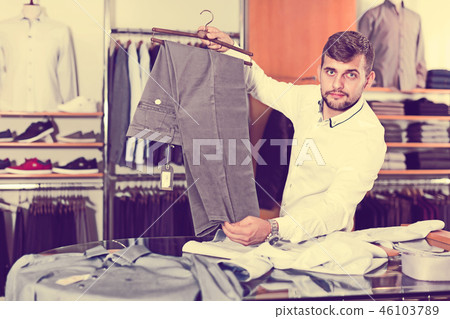 Positive man choise new pair of pants Positive man choise new pair of pants 46103789