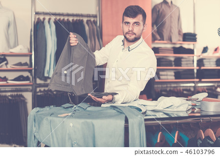 Nice man choise new pair of pants 46103796