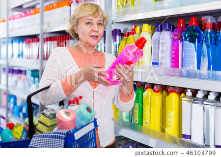 buyer holding basket with goods for cleaning house buyer holding basket with goods for cleaning house 46103799