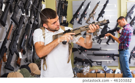 Men choosing air weapon Men choosing air weapon 46103882