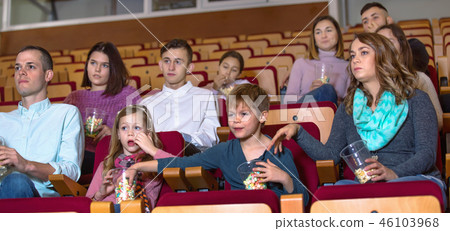 Number of people enjoying film screening and popcorn Number of people enjoying film screening and popcorn 46103968
