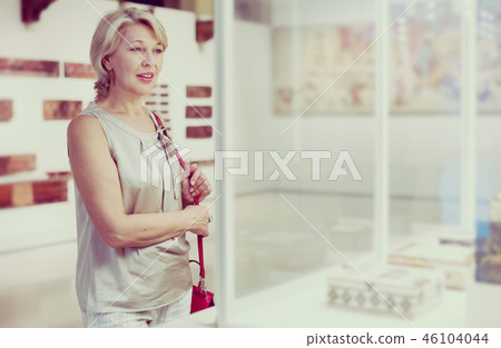 Positive woman in the historical museum 46104044