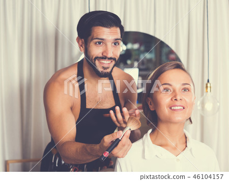 Professional makeup artist applying cosmetics Professional makeup artist applying cosmetics 46104157