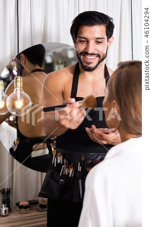 makeup artist applying cosmetics for female 46104294