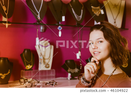 Young woman staying in the store Young woman staying in the store 46104922