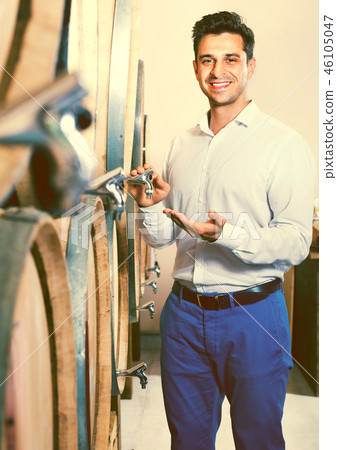 Man customer standing in winery store with woods 46105047