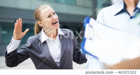Angry businesswoman is chastising the employee Angry businesswoman is chastising the employee 46105102