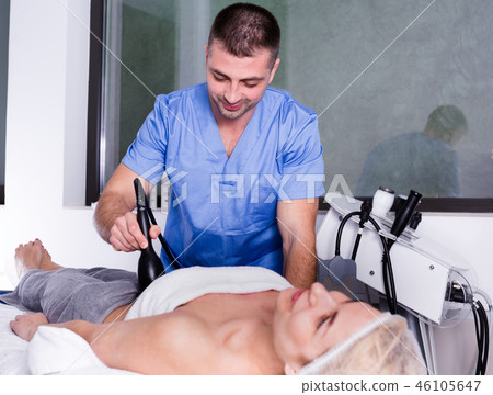 Cosmetologist during hardware procedure Cosmetologist during hardware procedure 46105647