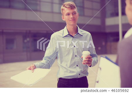 Young manager is talking with partner before signing contract 46105692
