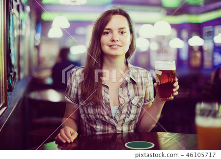 girl in bar with beer girl in bar with beer 46105717