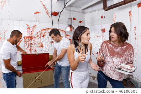 Scared girls with medical instruments in lost room 46106503