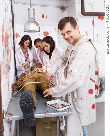 Guy with mad look over zombie mannequin 46106520