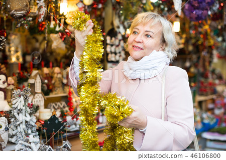 female choosing garland for Christmas 46106800