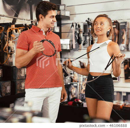 Woman and man purchasers in the sex shop 46106888