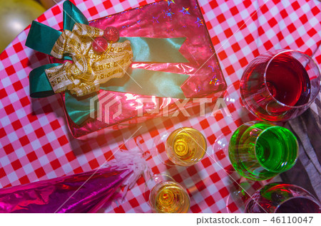 Christmas presents with red ribbon and food party Christmas presents with red ribbon and food party 46110047