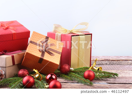 Happy Holidays. New Year or Christmas decorations with gift boxes, candles and balls. greeting card. 46112497