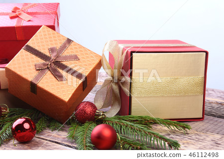 Happy Holidays. New Year or Christmas decorations with gift boxes, candles and balls. greeting card. 46112498
