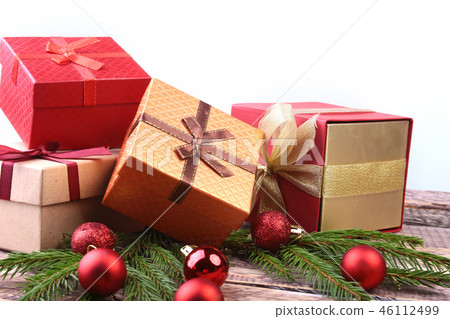Happy Holidays. New Year or Christmas decorations with gift boxes, candles and balls. greeting card. Happy Holidays. New Year or Christmas decorations with gift boxes, candles and balls. greeting card. 46112499