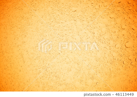 Rain droplets on yellow glass background. 46113449