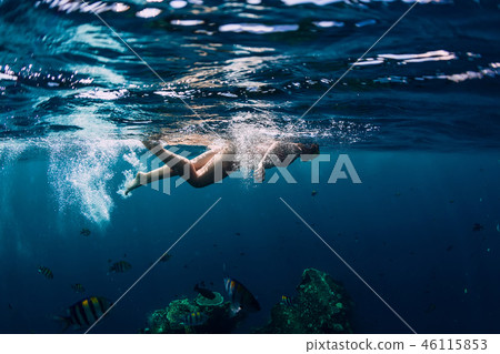 Woman swim in the tropical ocean at shipwreck 46115853