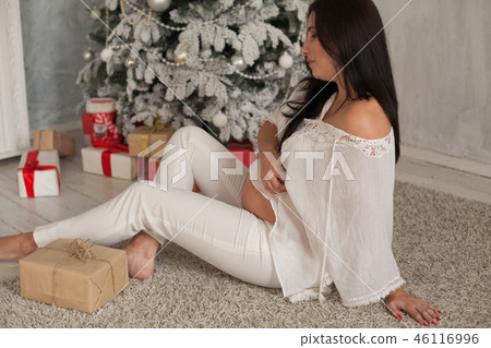 pregnant woman Christmas tree new year gifts holidays 46116996