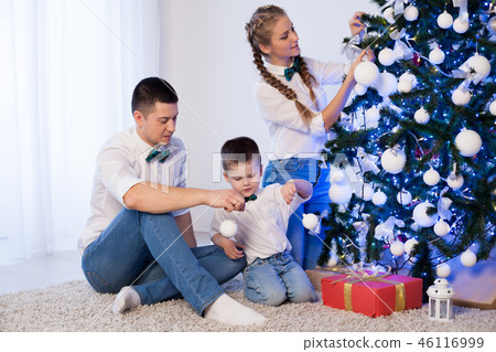 mom dad and son decorate Christmas tree gifts new year tree winter holiday Garland 46116999