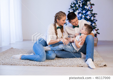 mom dad and son decorate Christmas tree gifts new year tree winter holiday Garland 46117000